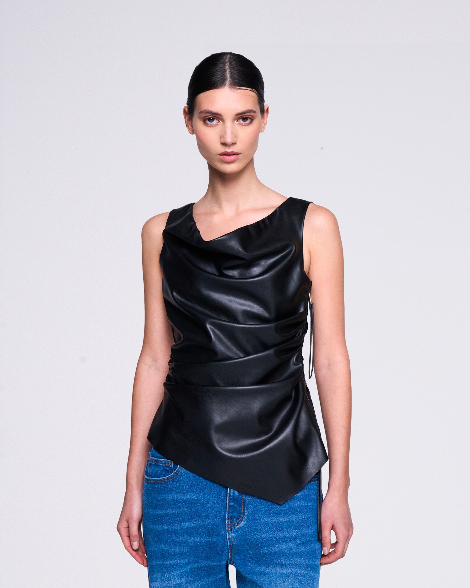 Asymmetrical faux leather top